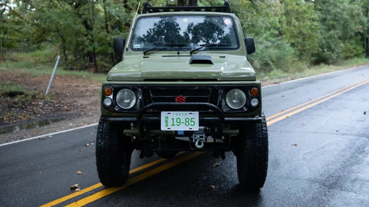 Front view of the Suzuki Jimny grille, headlights, and winch