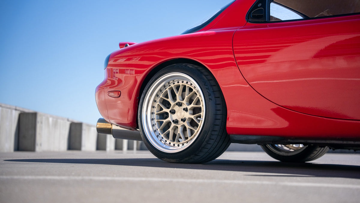 Rear gold BC Racing mesh wheel and exhaust tip